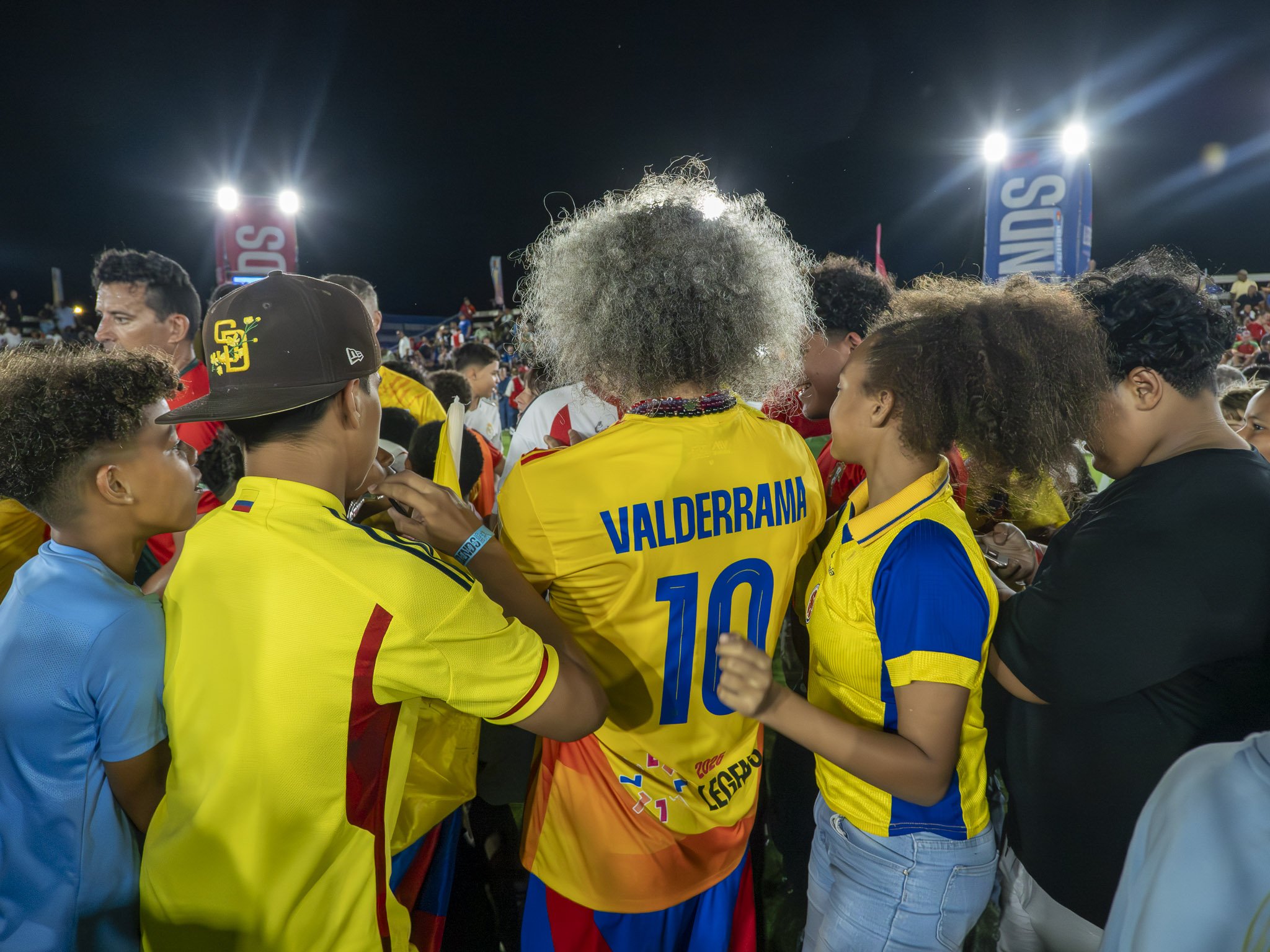 El Pibe, the Colombian Legend gets rushed by fans for an autograph. Photo by Mario Casamahuapa