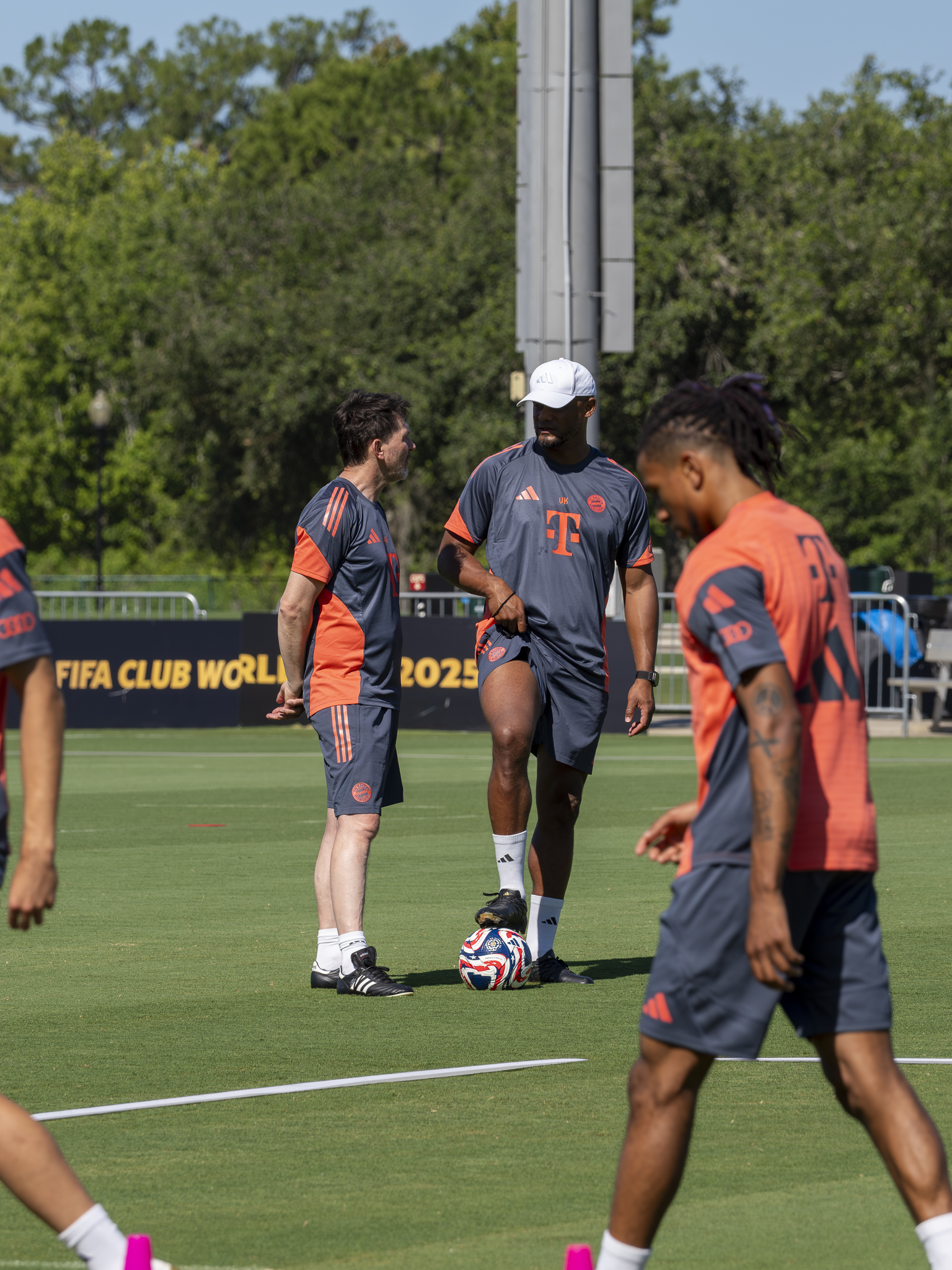Vincent Kompany stands and watches practice at the ESPN Complex. Photo by Mario Casamalhuapa