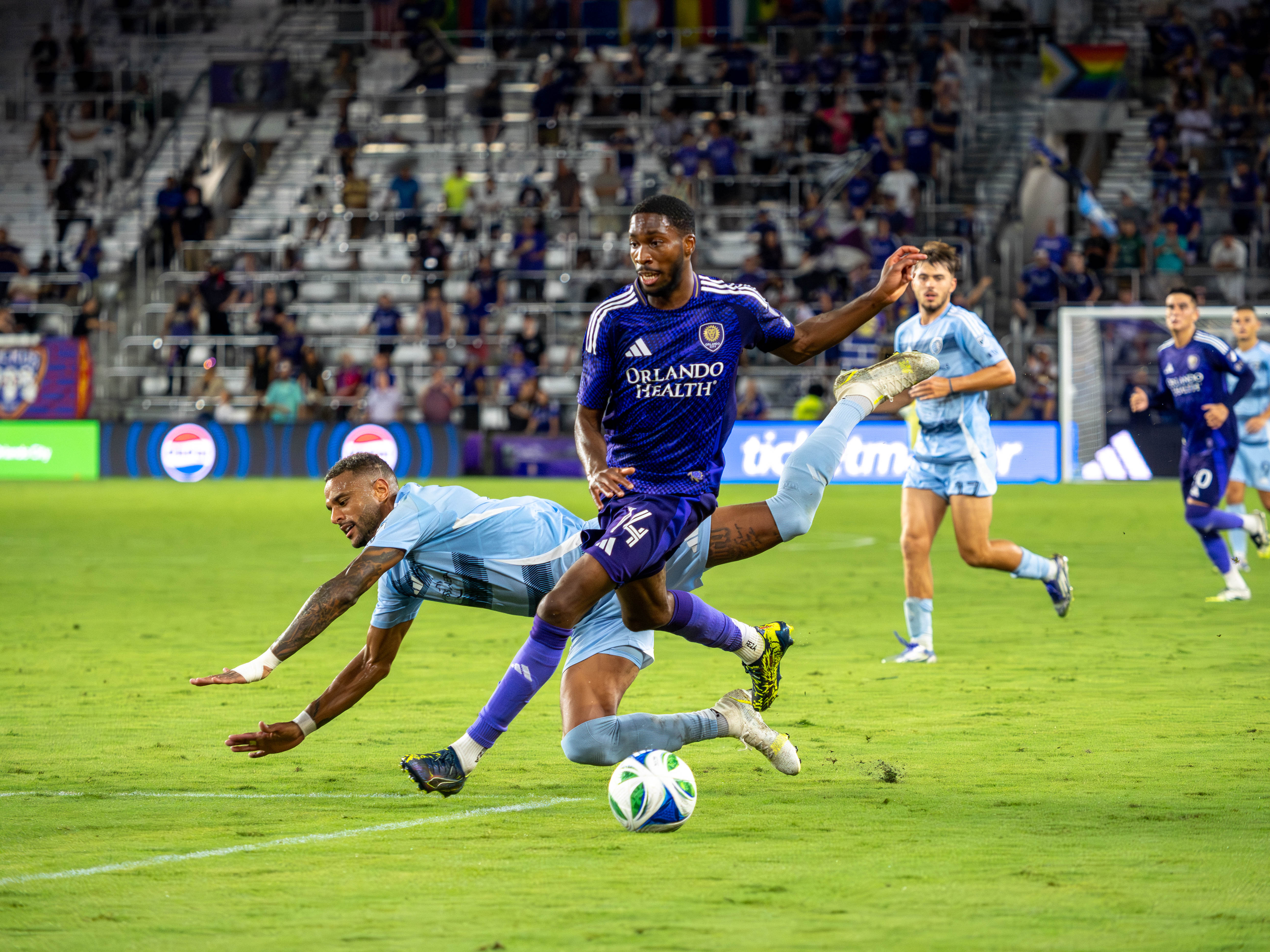 Tyrese Spicer dribbles past a player and takes a shot of goal.